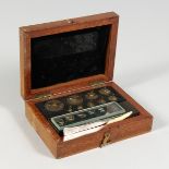 L. DERTLING OF LONDON, set of gold weights, 1000 downwards, in a mahogany case.