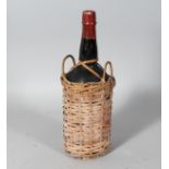 WILLIAMS & HUMBERT LTD., a bottle of sherry in a wicker bottle holder.