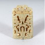 A PIERCED AND CARVED ARCHAIC JADE PENDANT. 2.5ins.