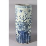 A CHINESE BLUE AND WHITE UMBRELLA STAND, dragon decoration. 24ins high.