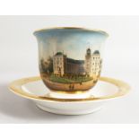 A BERLIN TOPOGRAPHICAL CUP AND SAUCER.