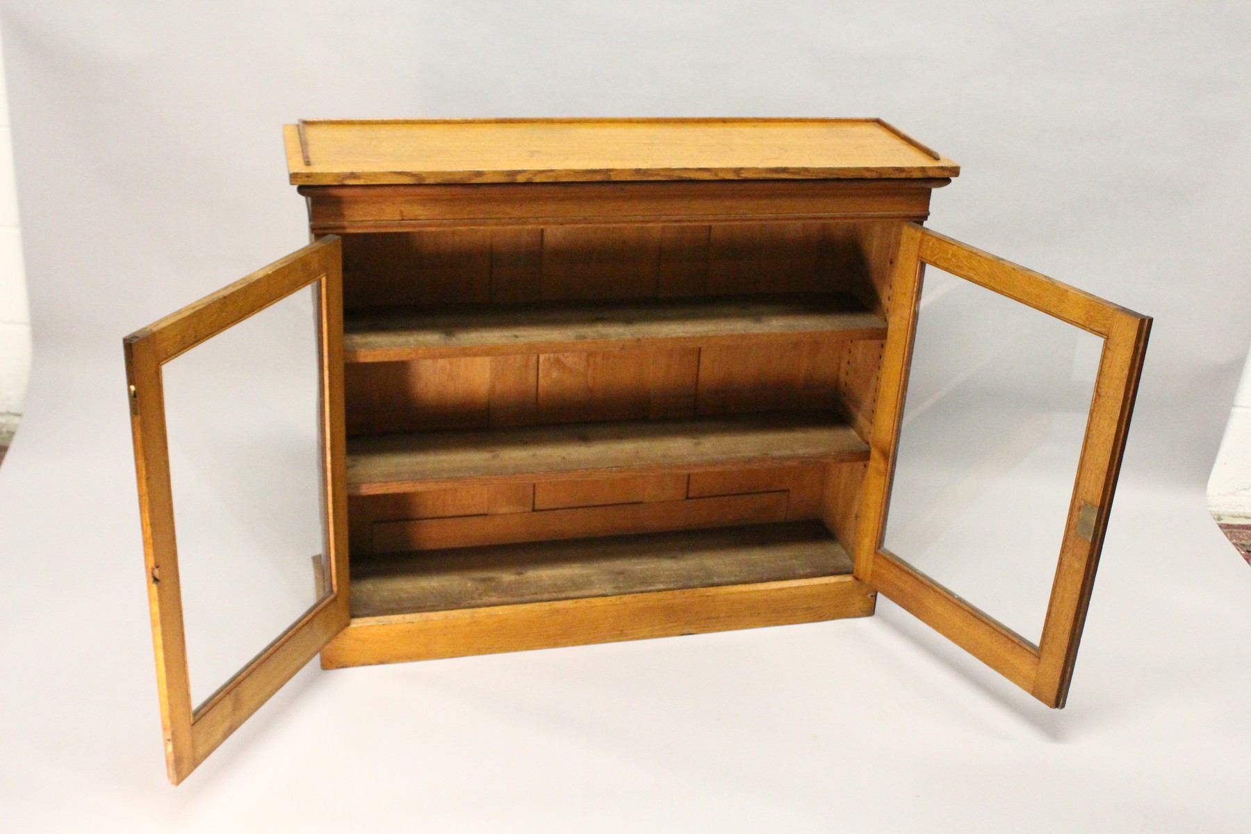 A VICTORIAN LIGHT OAK TWO-DOOR BOOKCASE, with a pair of glazed doors enclosing adjustable shelves, - Image 5 of 5