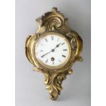 A SMALL 19TH CENTURY FRENCH LOUIS XVI DESIGN CARTEL CLOCK in an acanthus scrolled frame. 9ins long.
