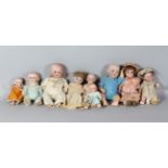 A COLLECTION OF NINE ANTIQUE DOLLS.