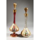 TWO BULBOUS OVERLAY SCENT BOTTLES AND STOPPERS, painted with flowers. 11ins and 9.5ins high.
