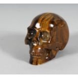 A TIGER'S EYE SKULL. 3.5ins.