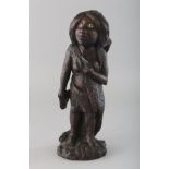 A POLYNESIAN CARVED WOOD STANDING FEMALE FIGURE with mother-of-pearl eyes. 10ins high.