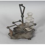 A CHRISTOPHER DRESSER CRUET STAND. Maker: H. & H.