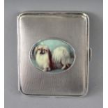 AN ENGINE TURNED SILVER CIGARETTE CASE, Chester 1904, with an oval of a Pekingese dog.