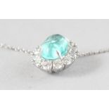 A SUPERB 18CT YELLOW AND WHITE GOLD, PARAIBA TOURMALINE (1.53cts) AND CABOCHON DIAMOND (0.60cts)