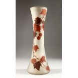 A FRENCH OPAQUE GLASS VASE, with waisted sides, painted in autumnal colours with leaves and berries,