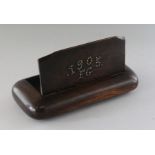 AN OVERSIZED FOLK ART TABLE SNUFF BOX with studded brass top. 1905 KG. 10ins long.