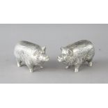 A PAIR OF CAST 800 PIG SALT AND PEPPERS. 2.5ins long.