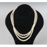 A TRIPLE ROW PEARL NECKLACE.