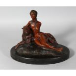 A BRONZE NUDE WITH A LEOPARD on an oval marble base. 11ins long.