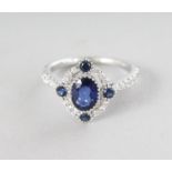 AN 18CT WHITE GOLD, SAPPHIRE (1.29cts) AND DIAMOND (0.40cts) VINTAGE STYLE RING.