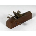 A MINIATURE BRONZE PLANE. 3.25ins long.