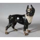 A PAINTED CAST IRON DOG DOORSTOP. 9ins long.