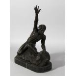 A BRONZE MALE NUDE, arm raised, on a marble base. 14ins high.
