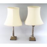 A PAIR OF MAPPIN & WEBB CORINTHIAN COLUMN CANDLESTICK AS LAMPS. 12ins high. Sheffield 1904.