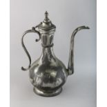 A TINNED COPPER ISLAMIC EWER. 14ins high.