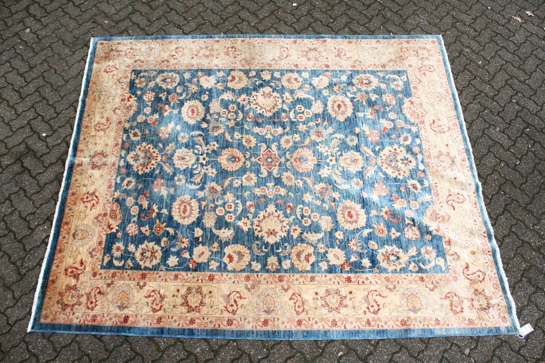 A ZIEGLER CARPET, 20th century, pale blue ground with stylised palmettes and floral decoration