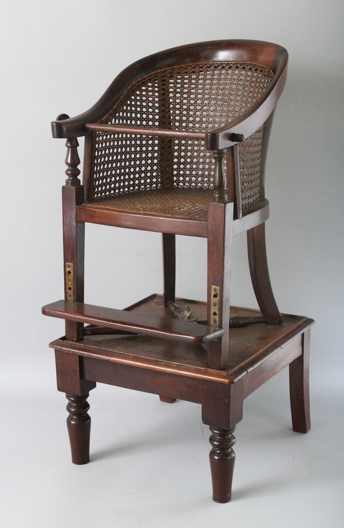 A 19TH CENTURY BERGERE STYLE HIGH CHAIR ON STAND. 2ft 8ins high.