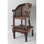 A 19TH CENTURY BERGERE STYLE HIGH CHAIR ON STAND. 2ft 8ins high.