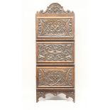 A LATE 19TH CENTURY WALNUT HANGING CORNER CUPBOARD, with profusely carved cresting and three