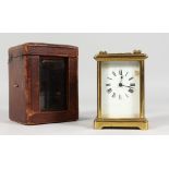 A GOOD FRENCH BRASS CARRIAGE CLOCK. 4.5ins, in a leather case.