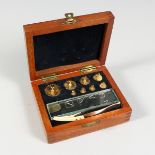 A SET OF GOLD WEIGHTS in a mahogany case, 1000 downwards.