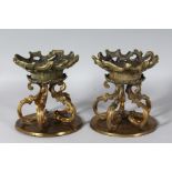 A PAIR OF 19TH CENTURY FRENCH GILT CIRCULAR STANDS. 7.5ins high.