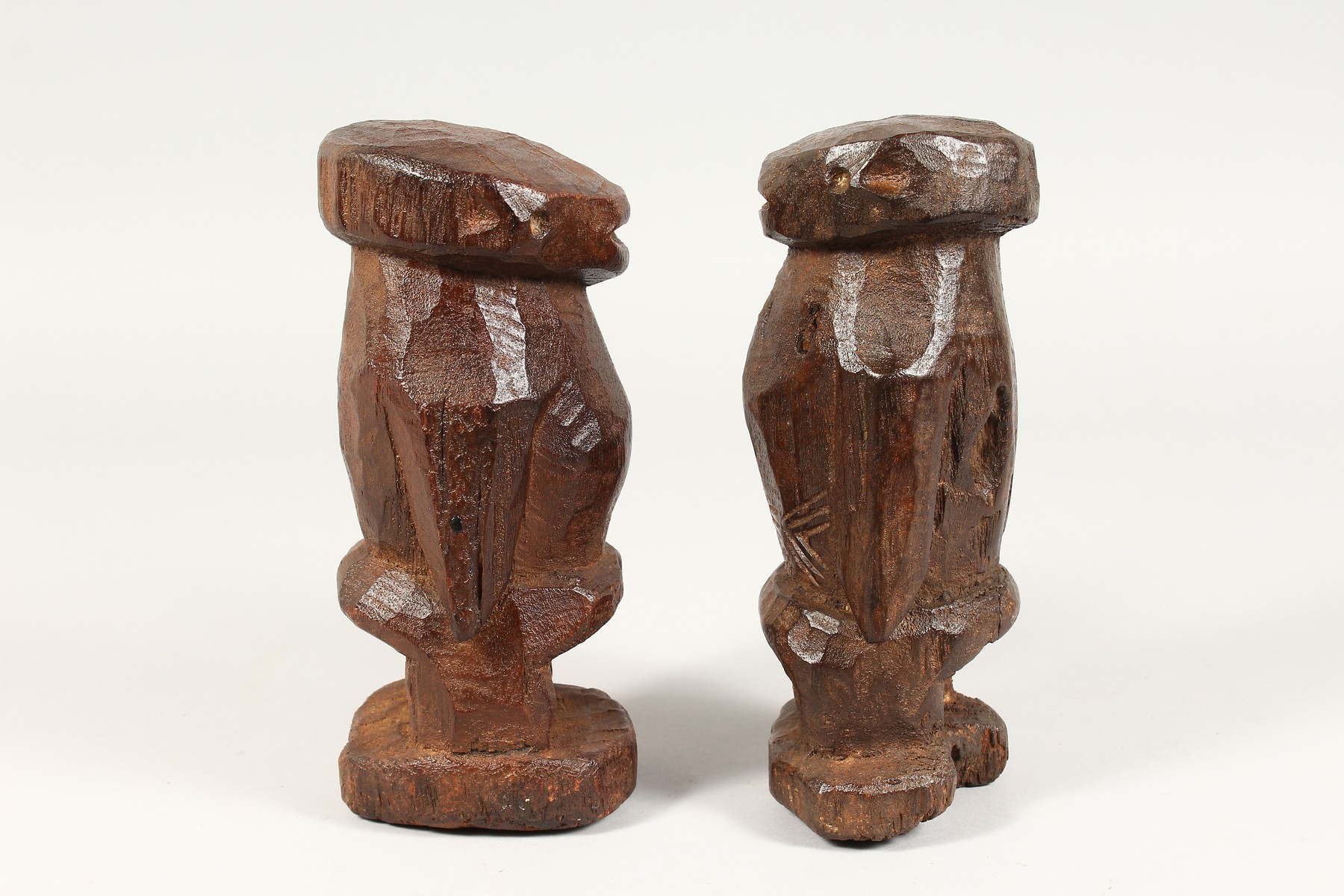 AN UNUSUAL PAIR OF TRIBAL CARVED WOOD STANDING FIGURES. 8ins high. - Image 3 of 4