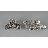 TWO NOVELTY SILVER DOG BROOCHES.