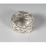 A SILVER KNOT RING.