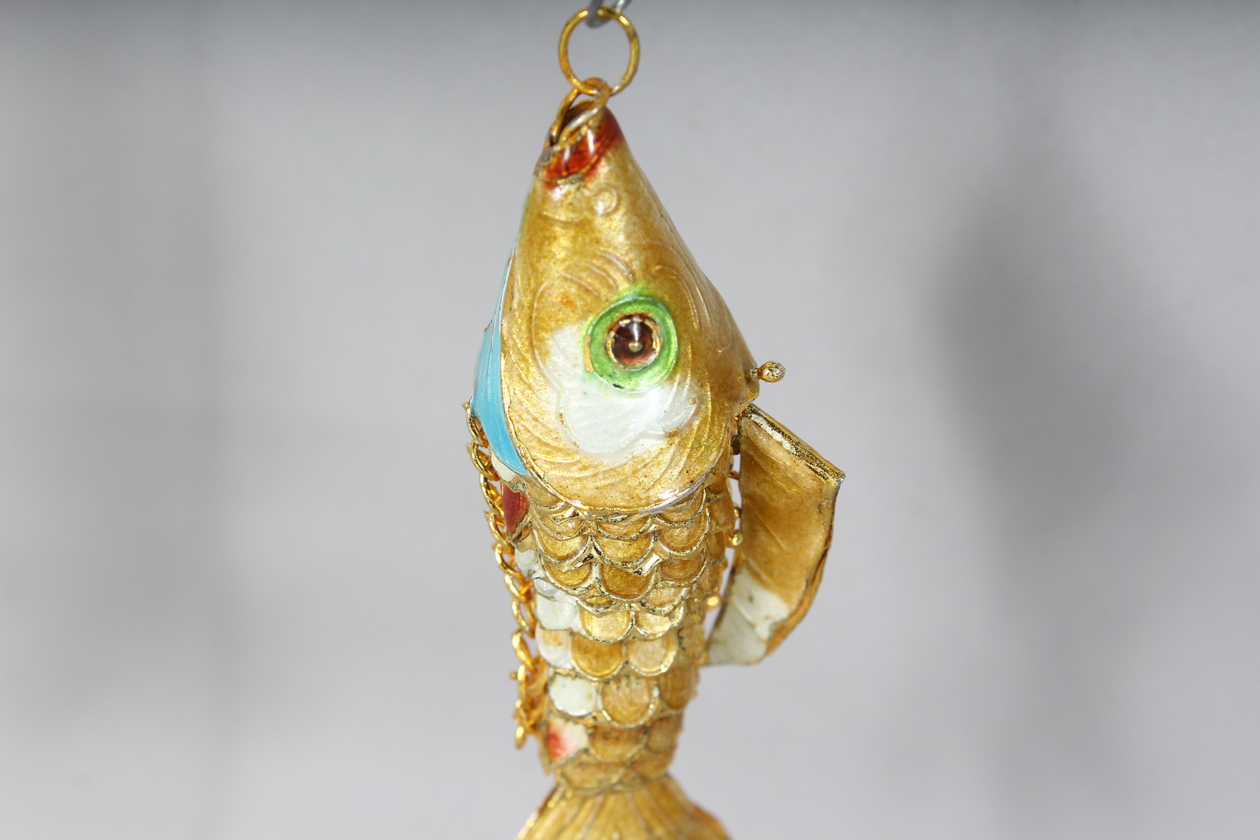 AN ENAMEL FISH PENDANT. 3.5ins long. - Image 2 of 3