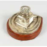 A SILVER PLATED HORSESHOE SHAPE INKSTAND, with cut glass ink bottle. 6ins wide.