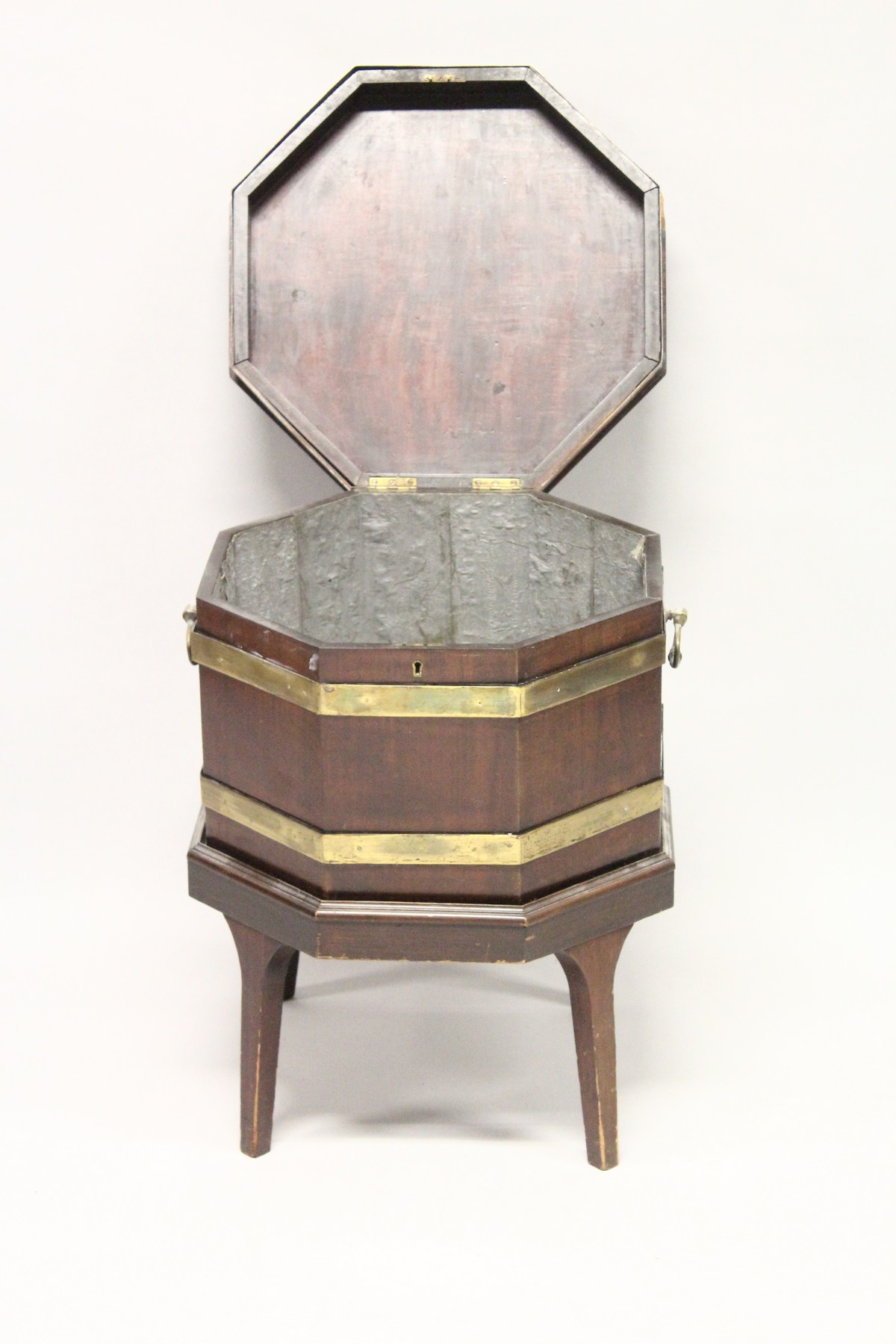 A GEORGE III MAHOGANY AND BRASS BOUND OCTAGONAL CELLARETTE , on tapering square legs. 1ft 8ins - Image 2 of 4