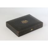 A LEATHER LETTER BOX, with gilt monogram and HER MAJESTY ROYAL COAT OF ARMS. 11.5ins.