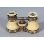 AN IVORY CASED PAIR OF OPERA GLASSES. 2.25ins, closed.