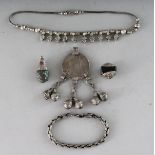 AN ISLAMIC SILVER NECKLACE with a coin, TWO PENDANTS AND CHAIN and BRACELET (4).