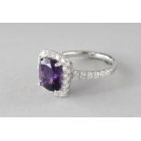A GOOD 18CT WHITE GOLD, AMETHYST AND DIAMOND RING.