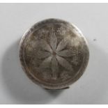 A 19TH CENTURY DUTCH SILVER CIRCULAR SNUFF BOX with engraved star top. 2.25ins diameter.