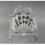 A SILVER PLATE SHELL SHAPED BISCUIT AND CHEESE STAND. 11ins high.