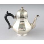 A QUEEN ANNE STYLE SILVER TEAPOT with ebony handle. Sheffield 1934. Weight 9ozs.