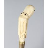 A CARVED BONE OCTOPUS HANDLE WALKING STICK. 35ins long.