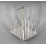 A PLAIN CHRISTOPHER DRESSER DESIGN TOAST RACK.