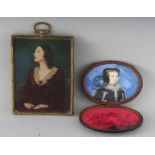A THREE-QUARTER LENGTH PORTRAIT MINIATURE OF A LADY, signed, 4ins x 3ins, and another oval miniature