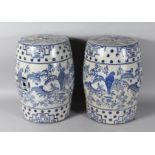 A PAIR OF CHINESE BLUE AND WHITE BARREL SEATS. 18ns high.
