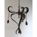 AN ART NOUVEAU HAMMERED CHANDELIER. 18ins.